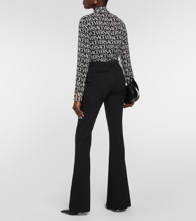Versace Black Flared Tailored Low Waisted Pants In Stretch Wool Woman In Black