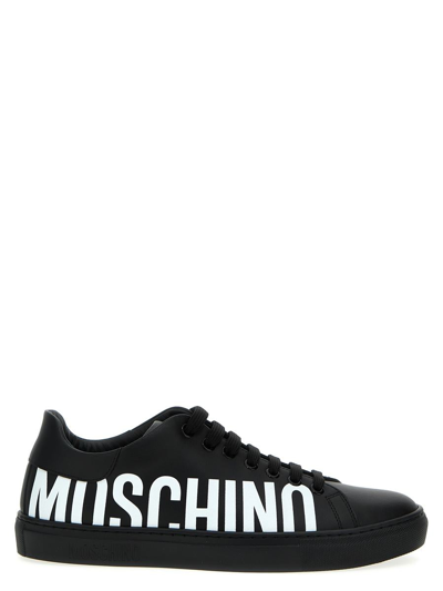 Shop Moschino Logo Sneakers In White/black