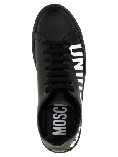 Shop Moschino Logo Sneakers In White/black