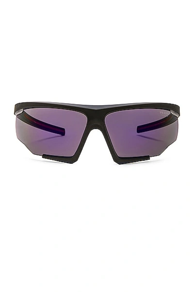 Shop Prada Shield Frame Sunglasses In Black & Purple