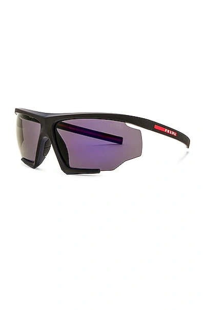 Shop Prada Linea Rossa Shield Frame Sunglasses In Black & Purple