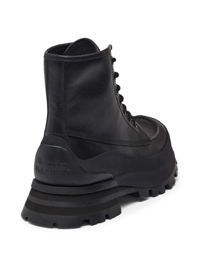 Shop Alexander Mcqueen Logo-embossed Leather Combat Boots In Black