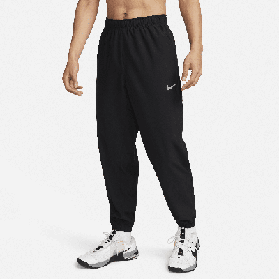 Shop Nike Men's Form Dri-fit Tapered Versatile Pants In Black