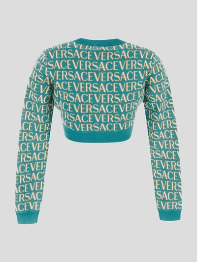 Shop Versace All Over Logo Knit Cropped Cardigan In Turquoise+light Blue