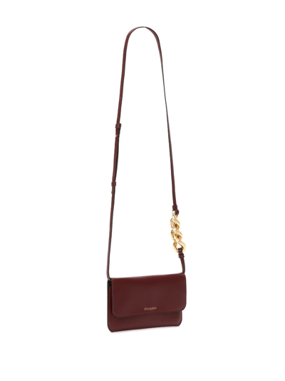 Shop Jw Anderson Chain-detail Pouch Crossbody Bag In Red