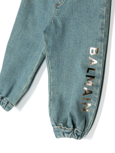 Shop Balmain Logo-print Elasticated Tapered Jeans In Blue