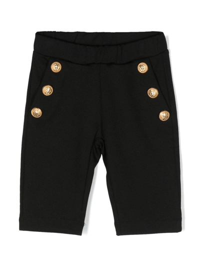 Shop Balmain Button-embellished Slip-on Leggings In Black