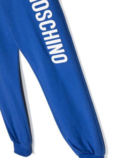 Shop Moschino Logo-print Cotton Track Pants In Blue