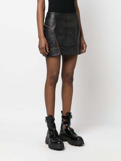 Shop Remain Mid-rise Zip-up Leather Miniskirt In Black