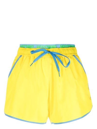 Shop Moschino Logo-waistband Drawstring Swim Shorts In Yellow