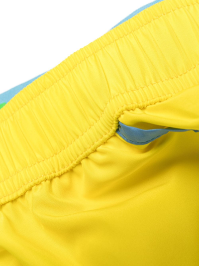 Shop Moschino Logo-waistband Drawstring Swim Shorts In Yellow