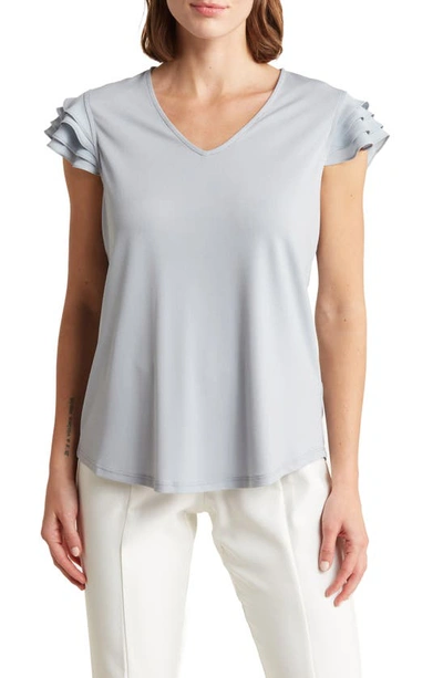 Shop Adrianna Papell V-neck Tiered Ruffle Sleeve Crepe Knit Top In Silver Mist