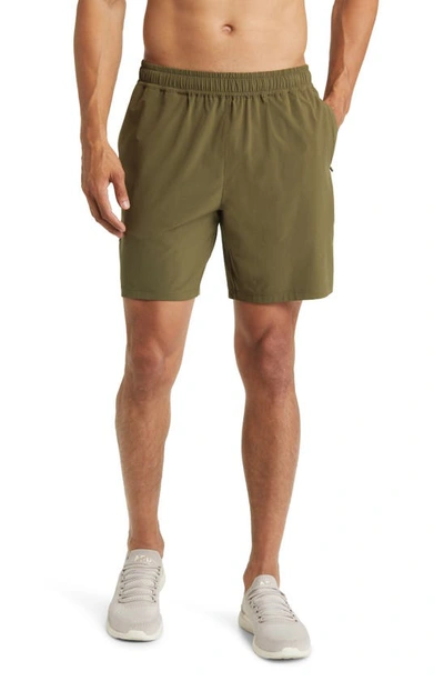 Shop Beyond Yoga Pivotal Performance Shorts In Beyond Olive