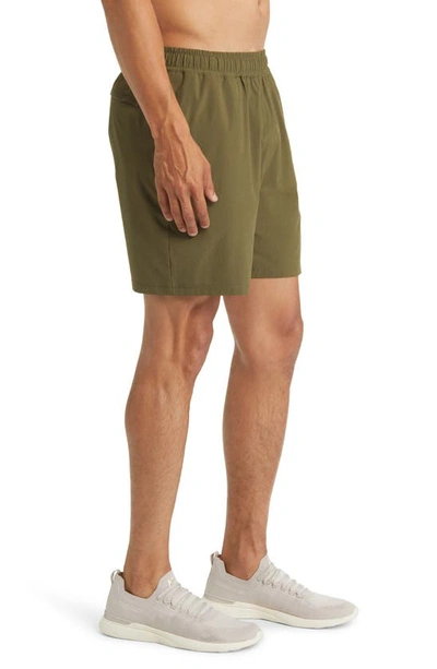 Shop Beyond Yoga Pivotal Performance Shorts In Beyond Olive