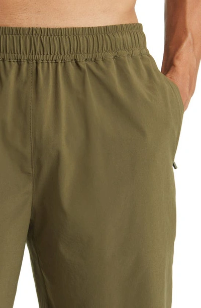 Shop Beyond Yoga Pivotal Performance Shorts In Beyond Olive