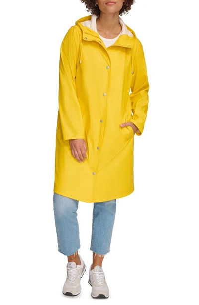 Shop Levi's Water Resistant Hooded Long Rain Jacket In Yellow