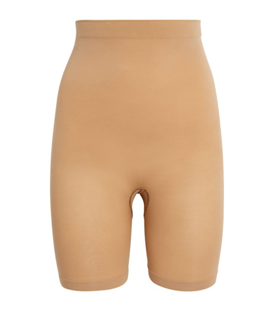 Shop Skims Seamless Sculpt Mid-thigh Shorts In Nude