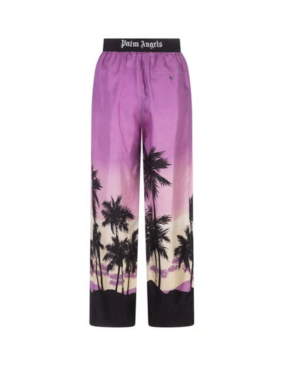 Shop Palm Angels Sunset Palm Print Trousers In Purple