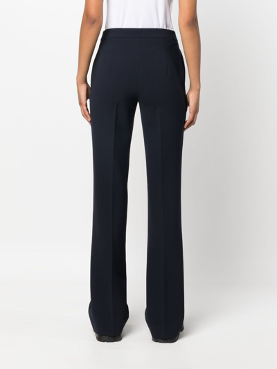 Shop Moschino Straight-leg Embossed-button Trousers In Blue