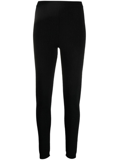 Shop Moschino Logo-pattern Print Knit Leggings In Black