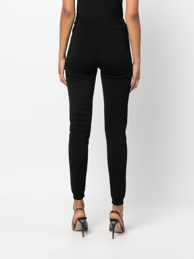 Shop Moschino Logo-pattern Print Knit Leggings In Black