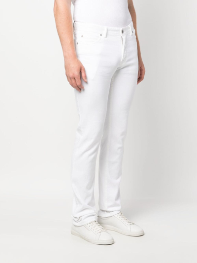 Shop Brioni Low-rise Slim-fit Jeans In White