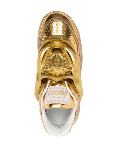 Shop Versace Sneakers In Golden