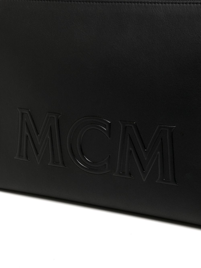 Shop Mcm Aren Embossed-logo Crossbody Pouch In Black