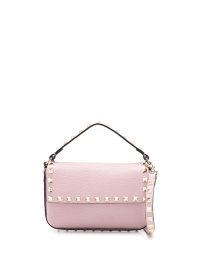 Shop Valentino Rockstud Embellished Crossbody Bag In Rosa