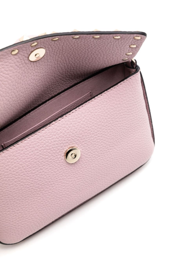 Shop Valentino Rockstud Embellished Crossbody Bag In Rosa