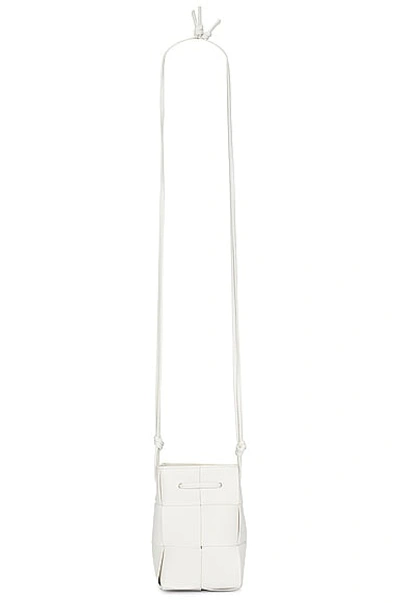 Shop Bottega Veneta Mini Crossbody Bucket Bag In White & Gold
