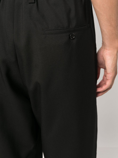 Shop Marni Tapered-leg Wool Trousers In Black