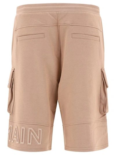 Shop Balmain Embossed Logo Shorts In Beige