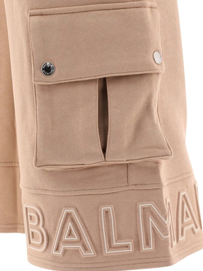 Shop Balmain Embossed Logo Shorts In Beige