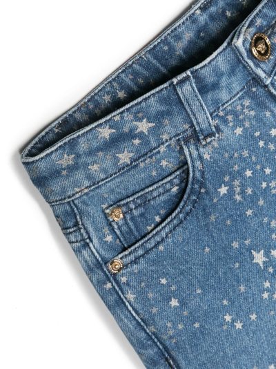 Versace Star-print Flared Denim Trousers In Blue