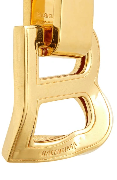 Shop Balenciaga Hourglass Logo Drop Earrings In Gold