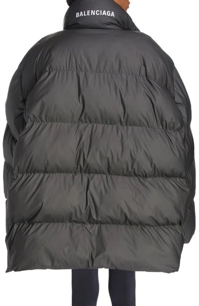 Shop Balenciaga Oversize Wrap Puffer Jacket In Black