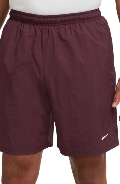 Shop Nike Solo Swoosh Water Repellent Nylon Shorts In Night Maroon/ White