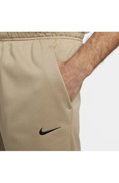 Shop Nike Therma-fit Tapered Training Pants In Khaki/ Khaki/ Black