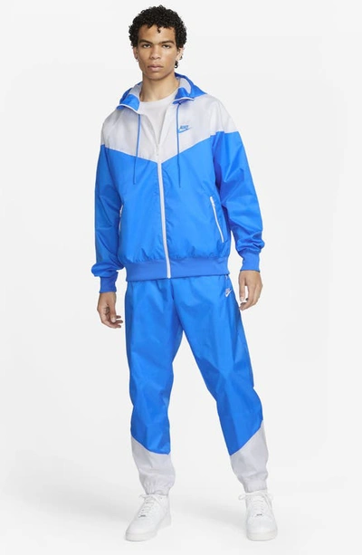 Shop Nike Windrunner Woven Lined Pants In Photo Blue/ White/ White