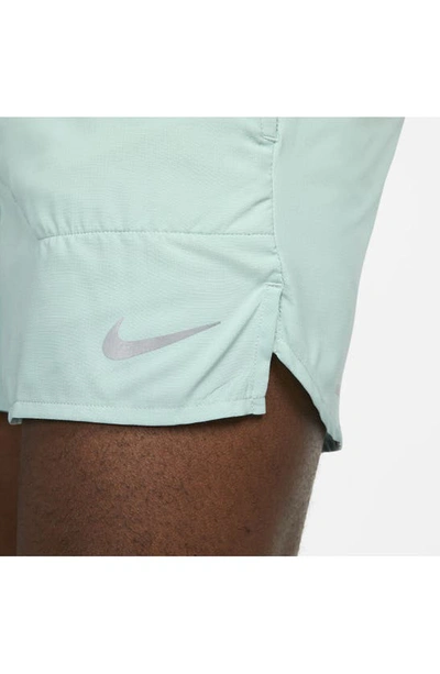 Shop Nike Dri-fit Stride 5-inch Running Shorts In Mineral/ Jade Ice