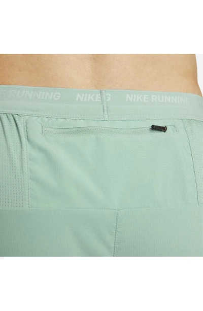 Shop Nike Dri-fit Stride 7-inch Brief-lined Running Shorts In Mineral/ Jade Ice