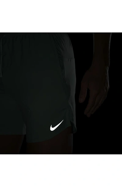 Shop Nike Dri-fit Stride 7-inch Brief-lined Running Shorts In Mineral/ Jade Ice