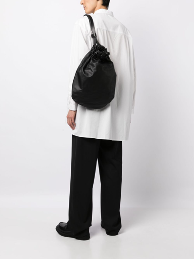 Shop Yohji Yamamoto Drawstring Leather Backpack In Black