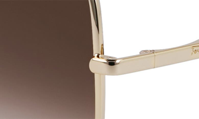 Shop Ferragamo Gancini 57mm Gradient Oval Sunglasses In Gold/ Brown Gradient