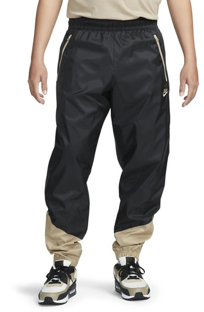 Shop Nike Windrunner Woven Lined Pants In Black/ Khaki/ Khaki