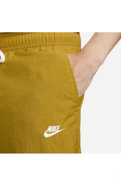 Shop Nike Club Drawstring Pants In Bronze/ White