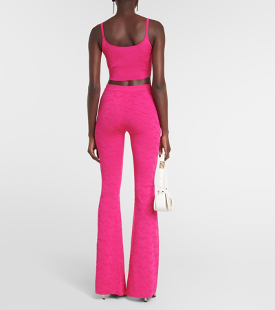 Shop Versace La Greca High-rise Flared Pants In Pink