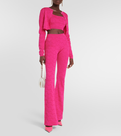 Shop Versace La Greca High-rise Flared Pants In Pink