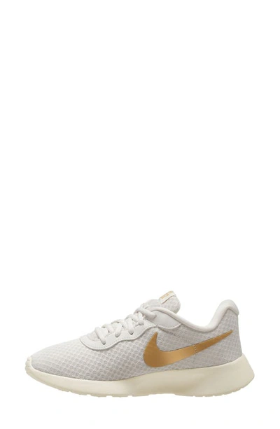 Shop Nike Tanjun Ease Shoe In Phantom/ Gold/ Sail/ Volt